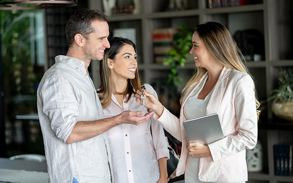 couple receiving keys from landlord